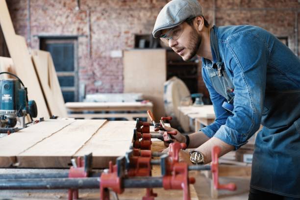 istock Successful handsome businessman with stylish cap work in carpentry 1212175168