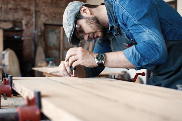 istock Successful handsome businessman with stylish cap work in carpentry 1212175183