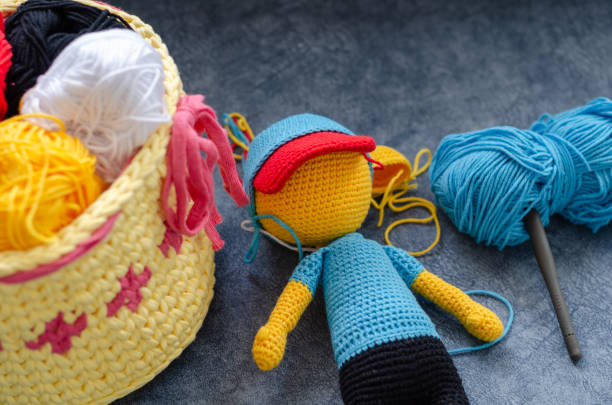 istock Amigurumi toy and colorful threads 1212175260