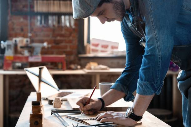 istock Successful handsome businessman with stylish cap work in carpentry 1212175460