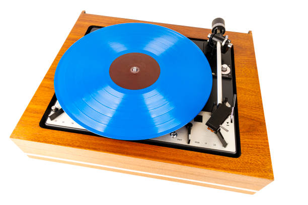 istock Vintage turntable with a blue vinyl isolated on white 1212176064