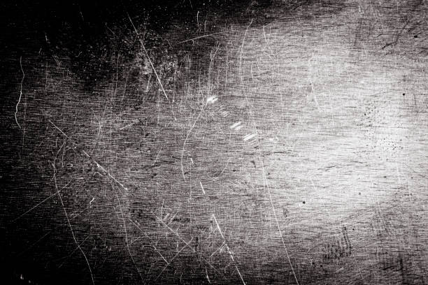 istock Scratched dirty dusty copper plate texture, black and white image. 1212176171