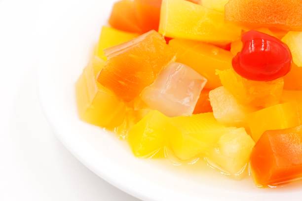 istock Canned fruit cocktail with pineapple, papaya, Nata de Coco and cherries 1212176655