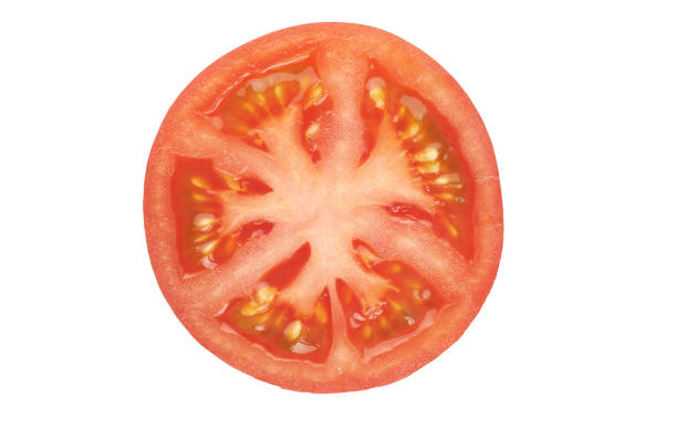 istock Slice of tomato isolated on white with clipping path 1212176772