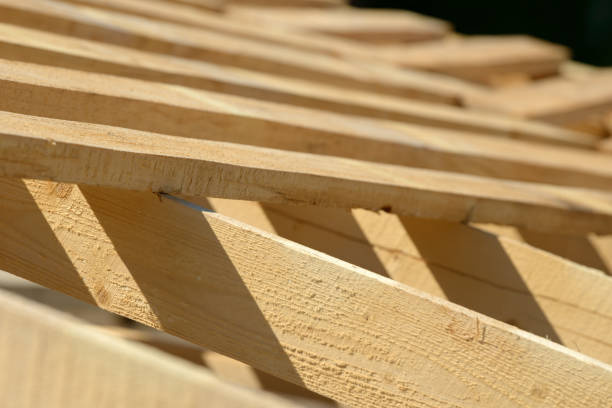 istock Wood board assembled on construction site. New frame structure of building. Scaffolding framework made from natural materials. Wooden floor or ceiling. Elements and components of the construction. 1212178703
