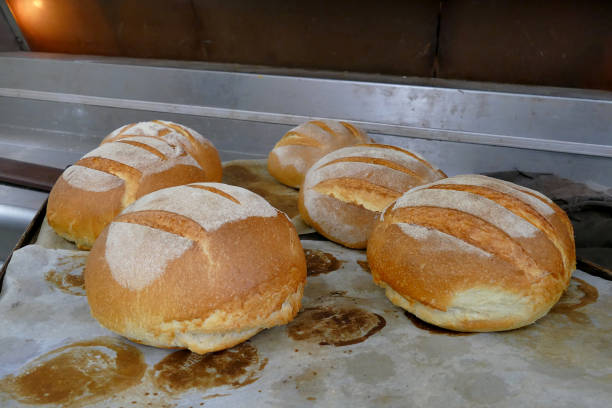 istock Fresh baked bread in an oven 1212178736