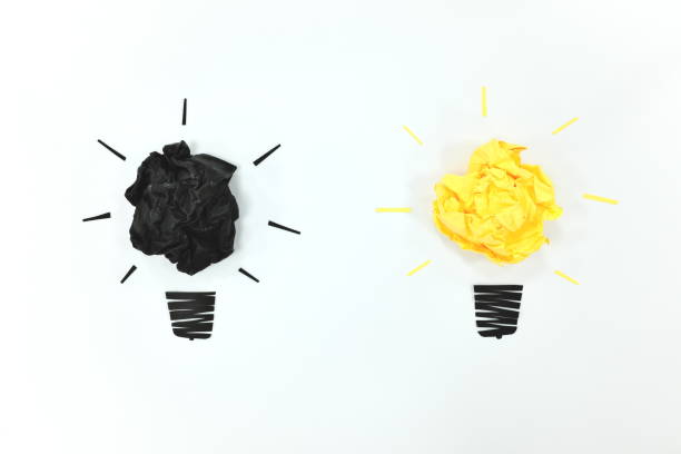 istock Black and yellow light bulb flat lay in white background. Creativity and new ideas concept. 1212178915