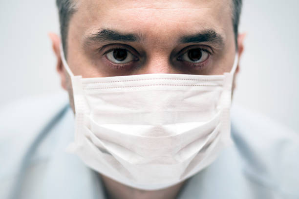 istock Man wearing protection face mask against coronavirus 1212180846