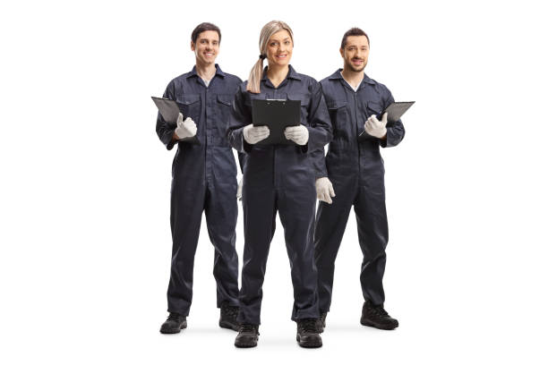 una donna e due lavoratori di sesso maschile in uniforme generale - manual worker full length isolated on white standing foto e immagini stock