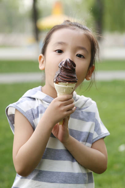 istock The little girl eats ice cream 1212181185