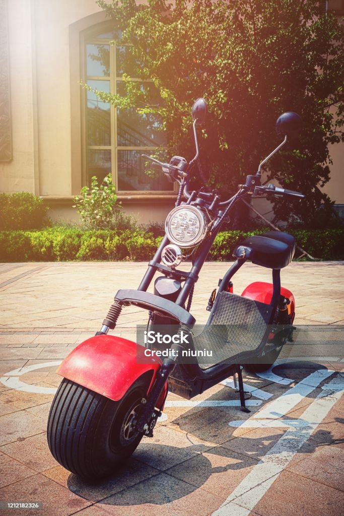 Electric motorcycle in the sunset. clean energy. Electricity Stock Photo