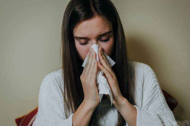 istock Woman sick in bed, covered with blanket 1212183425