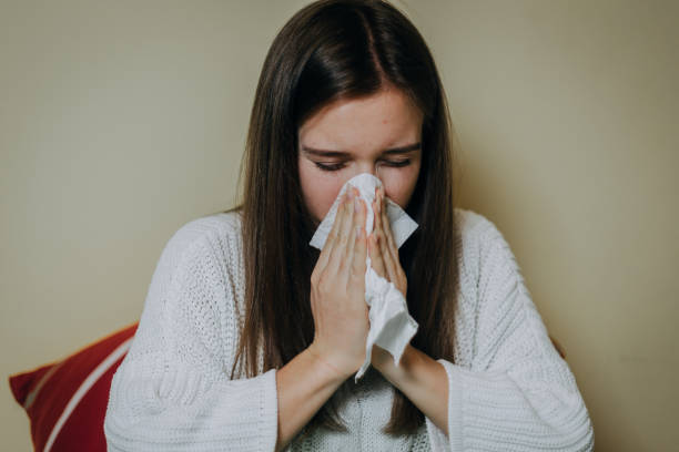 istock Woman sick in bed, covered with blanket 1212183570