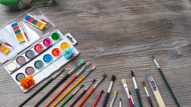 istock easter eggs and colorful paints and brushes, decorative chickens 1212183654