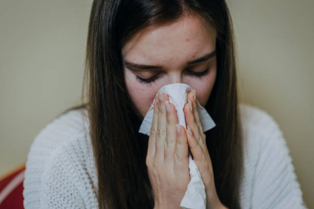 istock Woman sick in bed, covered with blanket 1212183682