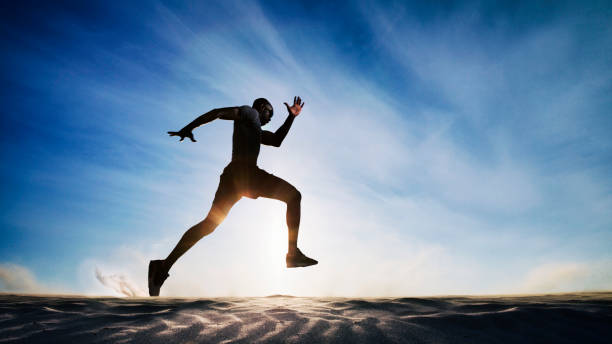 Man running on sand dunes. Man running on sand dunes. off track running stock pictures, royalty-free photos & images