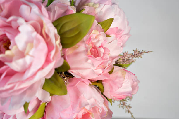 istock bouquet of pink peonies  on white  background copy space 1212186888