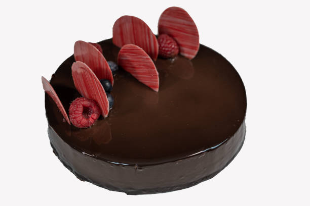 istock Round glazed chocolate cake with berries on top 1212186906