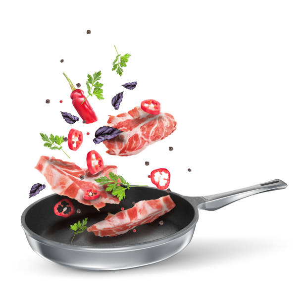 istock Veal steaks with red chili, parsley and basil. Fried spicy meat dish with spices in a pan. Vector flying composition isolated on white background 1212187247