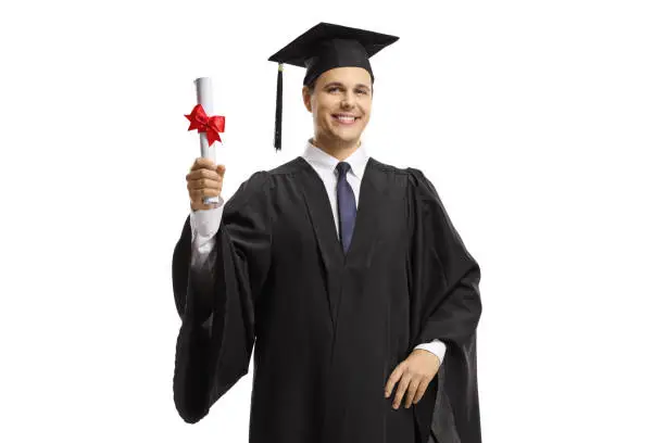 Male graduate holding a diploma isolated on white background