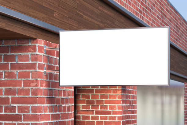 istock Horizontal signboard or signage on the red brick wall with blank white sign mock up. Side view. 1212190474