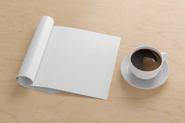 istock Blank magazine page. Workspace with folded magazine mock up on the desk. 1212190638