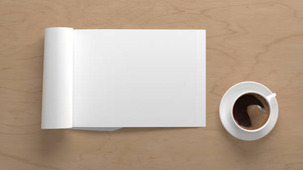 istock Blank magazine page. Workspace with folded magazine mock up on the desk. 1212190740