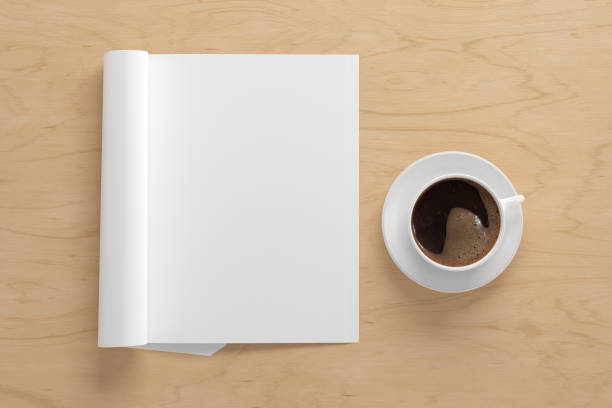 istock Blank magazine page. Workspace with folded magazine mock up on the desk. 1212190751