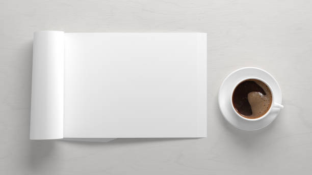 istock Blank magazine page. Workspace with folded magazine mock up on the desk. 1212191322