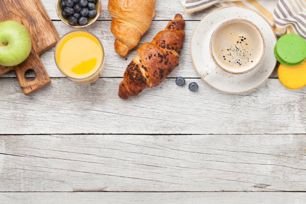 istock Breakfast with coffee and croissant 1212191326