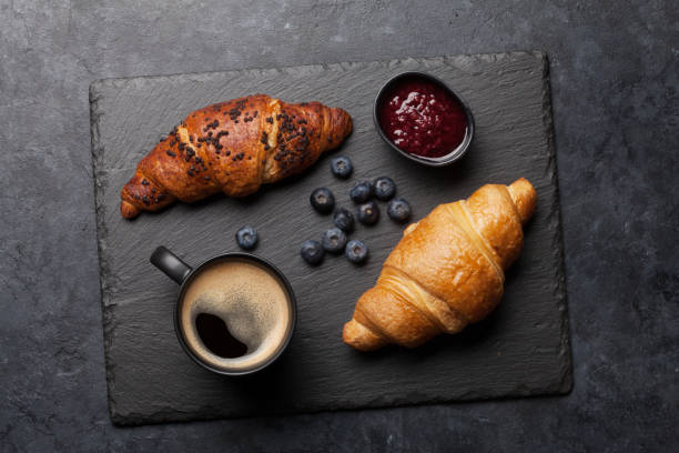 istock Breakfast with coffee and croissants 1212191335