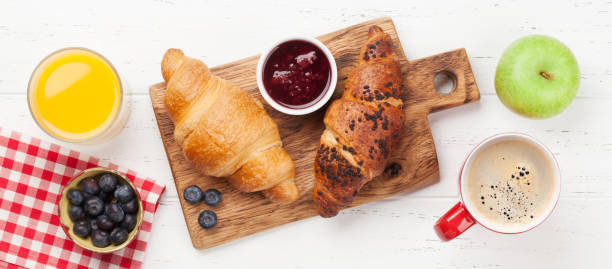 istock Breakfast with coffee and croissants 1212191387