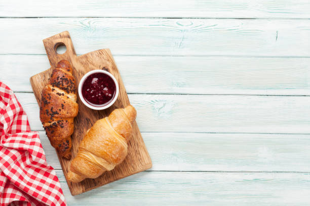 istock Fresh croissants with berry jam 1212191705
