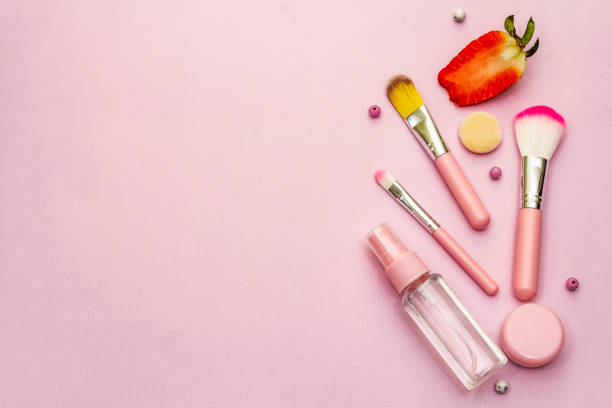istock Variety of makeup brushes. Cosmetic set on pink background. Professional decorative cosmetics 1212192995