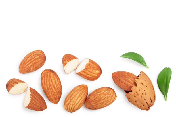 istock Almonds nuts with leaves isolated on white background with clipping path and full depth of field. Top view with copy space for your text. Flat lay 1212193306