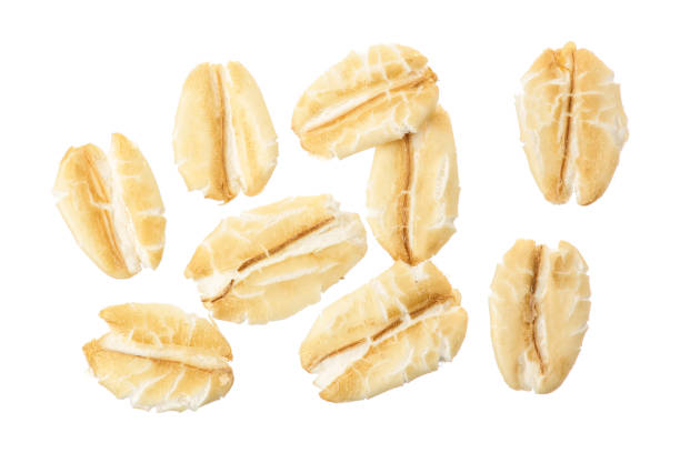 istock oat flakes isolated on white background. Top view 1212193328