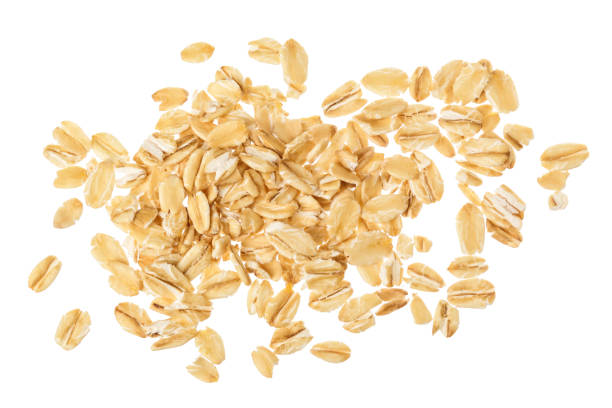 istock oat flakes isolated on white background. Top view 1212193335