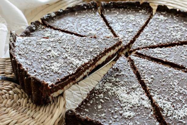 istock Sliced chocolate tart with coconut cream and crust 1212196299