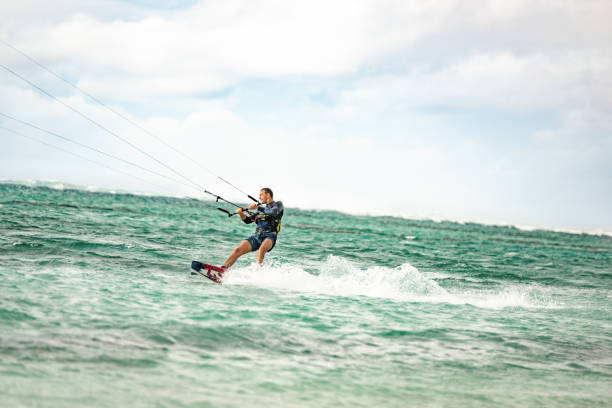 istock Mid Adult Man Kiteboarding. 1212196377