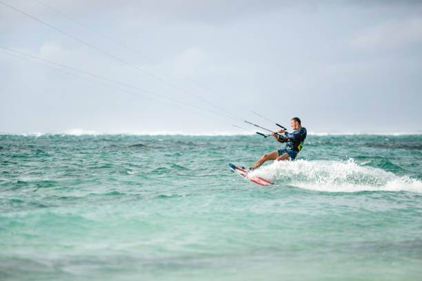 istock Side view of man kiteboarding at Mauritius island. 1212196758
