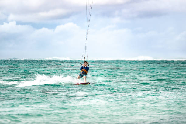 istock Mature man kiteboard surfing. 1212196817