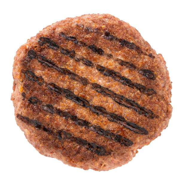 istock grilled burger meat isolated on white background, top view 1212197368