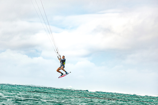 Kiteboarder flying in the air.