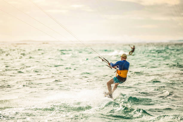 istock Mature man kiteboarding at Mauritius island. 1212197439