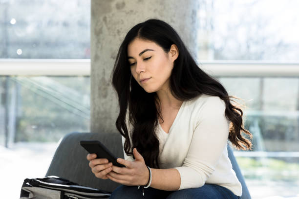 istock Woman seriously contemplates information on smart phone 1212201427