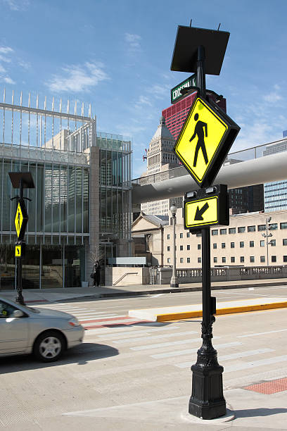 istock Pedestrian crossing sign in a downtown area 121220234