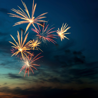 Brightly colorful fireworks and salute of various colors in the night sky