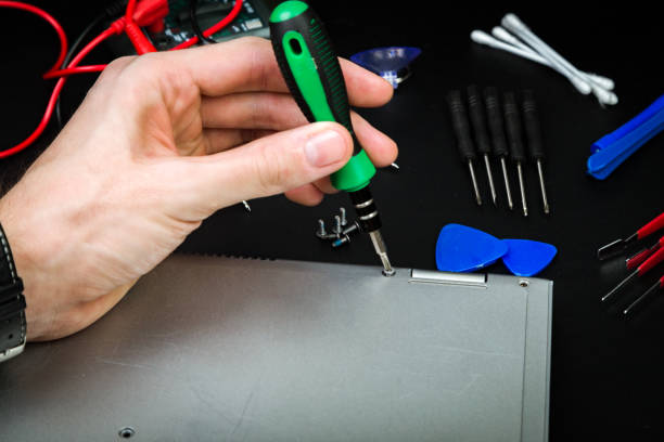 istock Repair a broken laptop with special tools 1212205526