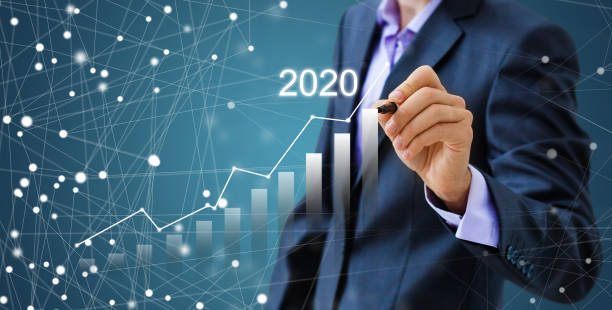 istock Businessman pressing 2020 start up business flat icon over gradient light blue background, Business happy new year cover concept 1212207860