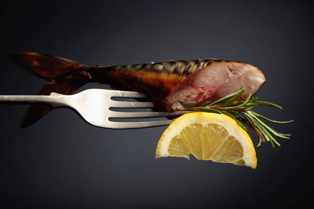 fish on coal grill with lemon and oregano